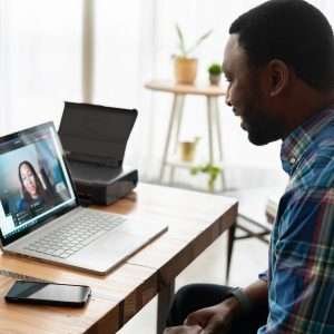 man being interviewed via video call