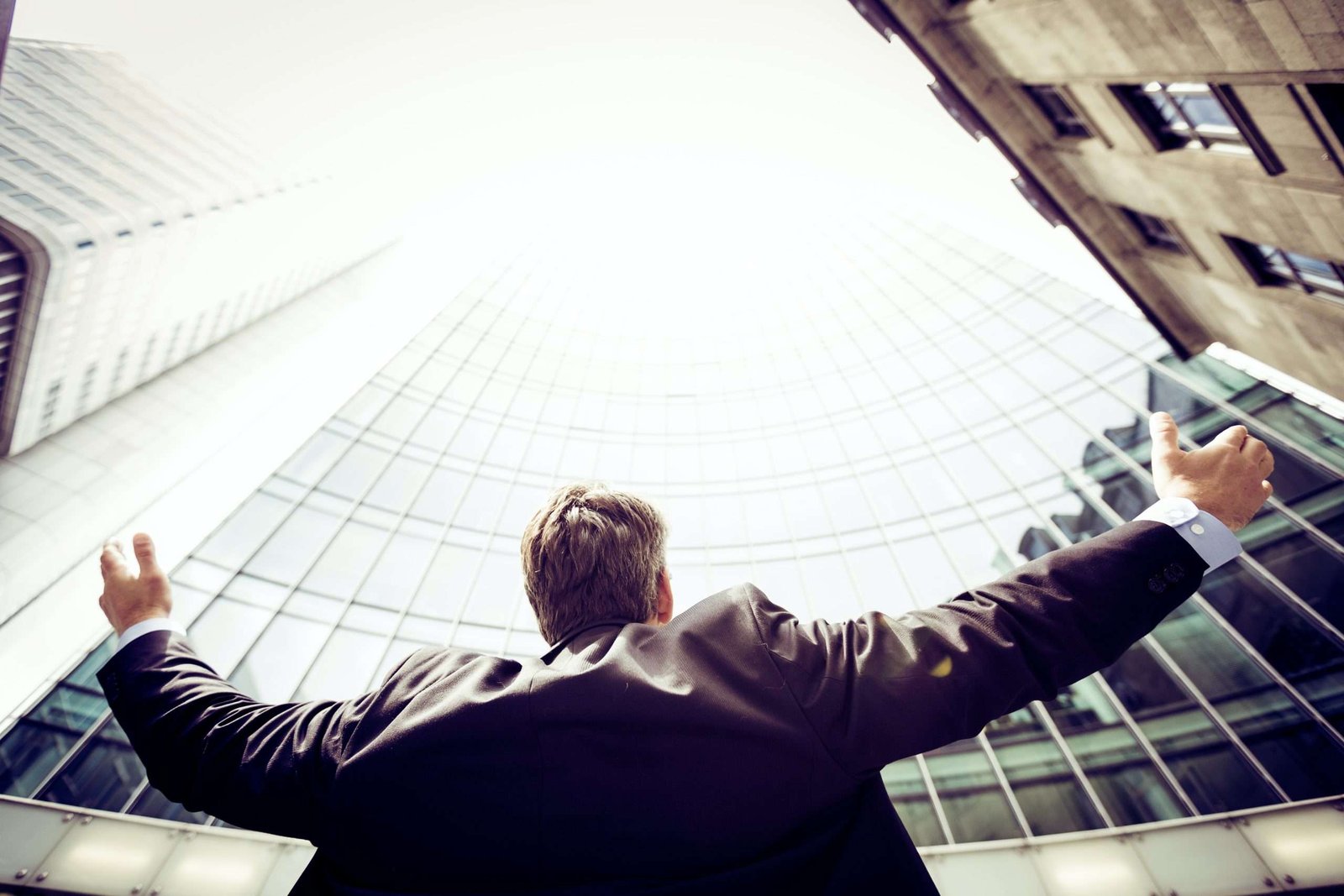 Hero image to hiring season sales page man looking up to office building